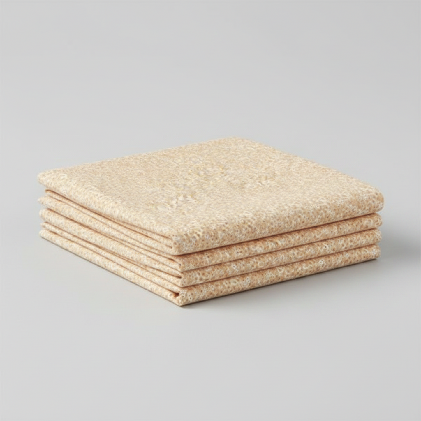 The Fox Homestead Cream Swirl Floral Texture quilting cotton by Stacy West for Henry Glass — three folded yards stacked on a grey surface, showing warm sand ground with tossed white paisley swirls and tiny rust and gold dot clusters