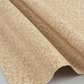 The Fox Homestead Cream Swirl Floral Texture quilting cotton in soft natural folds close-up — warm sand with white swirl print and rust dots, emphasizing fabric drape and texture, by Stacy West for Henry Glass
