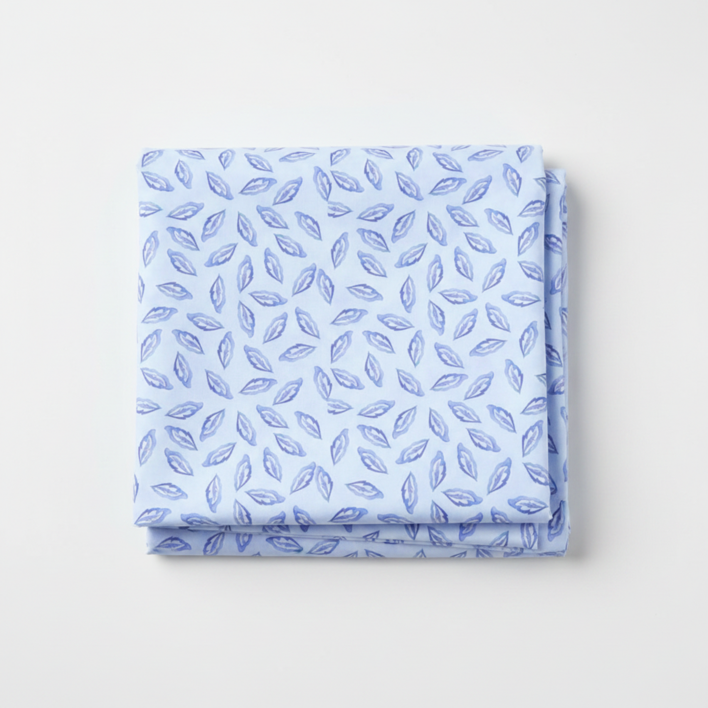 Daydreams Blue Tonal Leaves quilting cotton fabric folded to show allover tossed ditsy leaf pattern – soft periwinkle and lavender leaves on dreamy cornflower blue watercolor ground by Jason Yenter for In The Beginning Fabrics, digitally printed, 100% cotton, 3 yard cut