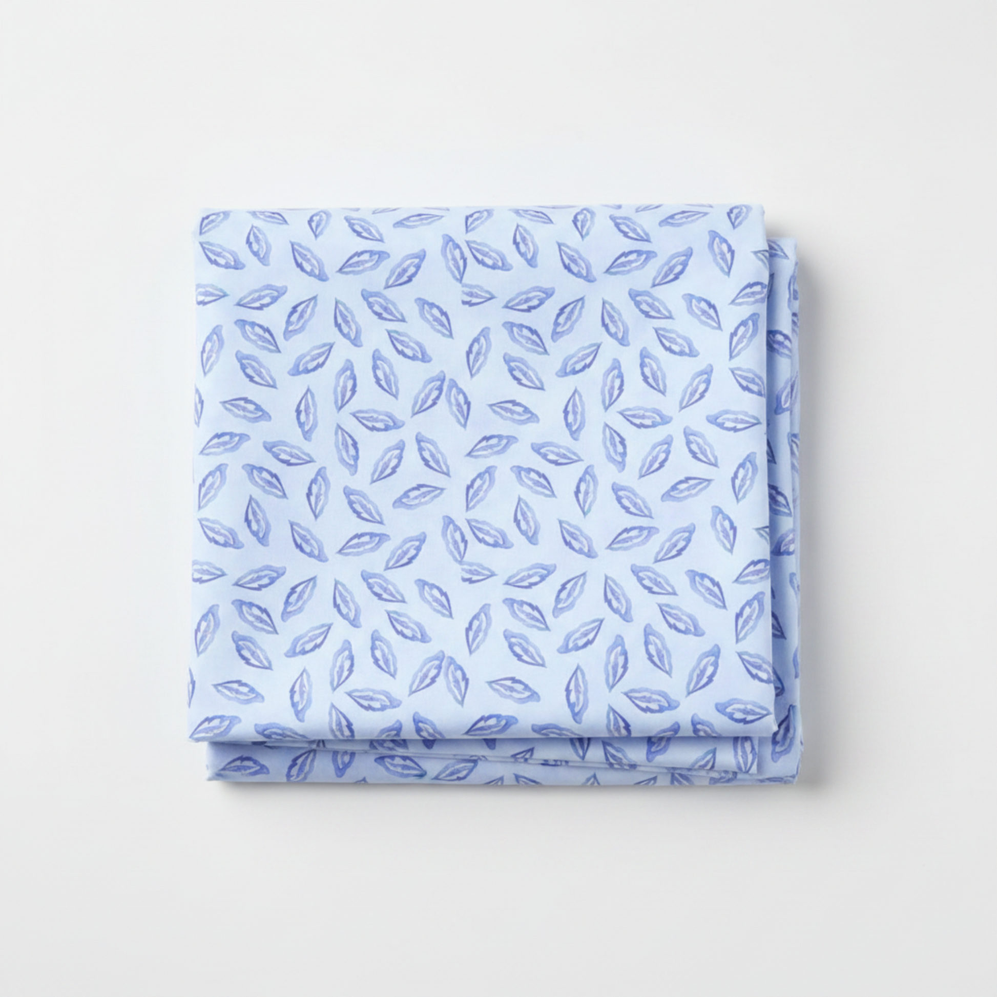 Daydreams Blue Tonal Leaves quilting cotton fabric folded to show allover tossed ditsy leaf pattern – soft periwinkle and lavender leaves on dreamy cornflower blue watercolor ground by Jason Yenter for In The Beginning Fabrics, digitally printed, 100% cotton, 3 yard cut