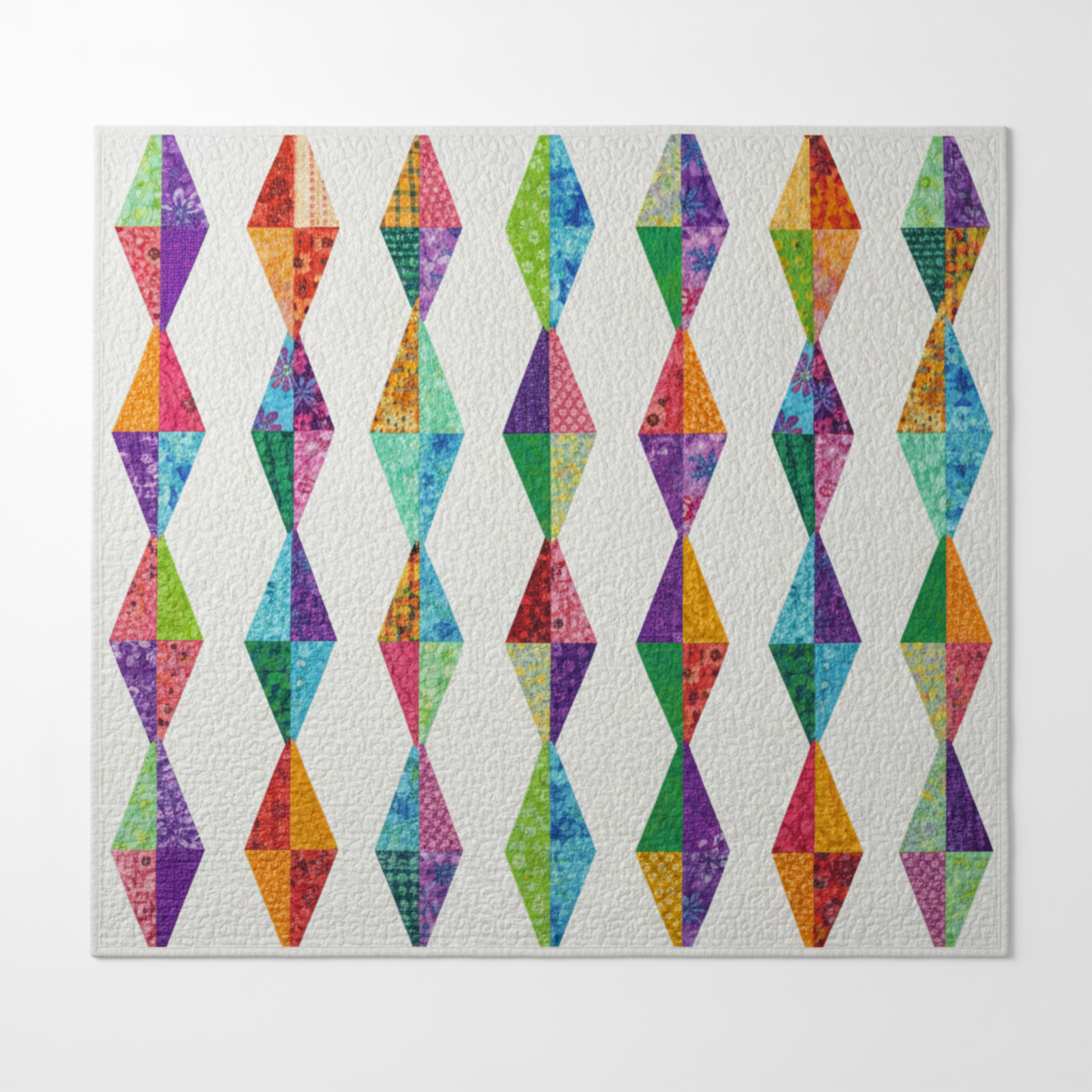 Diamond Daze quilt made with Interwoven Plum as the dominant fabric – vivid purple-violet elongated diamond blocks on white background, coordinating with periwinkle, pink, lime and butterscotch – Diamond Daze pattern by Sew Kind of Wonderful using Interwoven Plum fabric by Jason Yenter for In The Beginning Fabrics