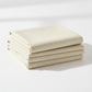 Dotty Thatched Washed Linen fabric folded and stacked – cream linen-toned dot crosshatch blender by Robin Pickens for Moda Fabrics