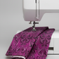 Needle Stars Chandelier Fuchsia marbled feather swirl quilting cotton draped over sewing machine — Paula Nadelstern for Benartex, 100% cotton