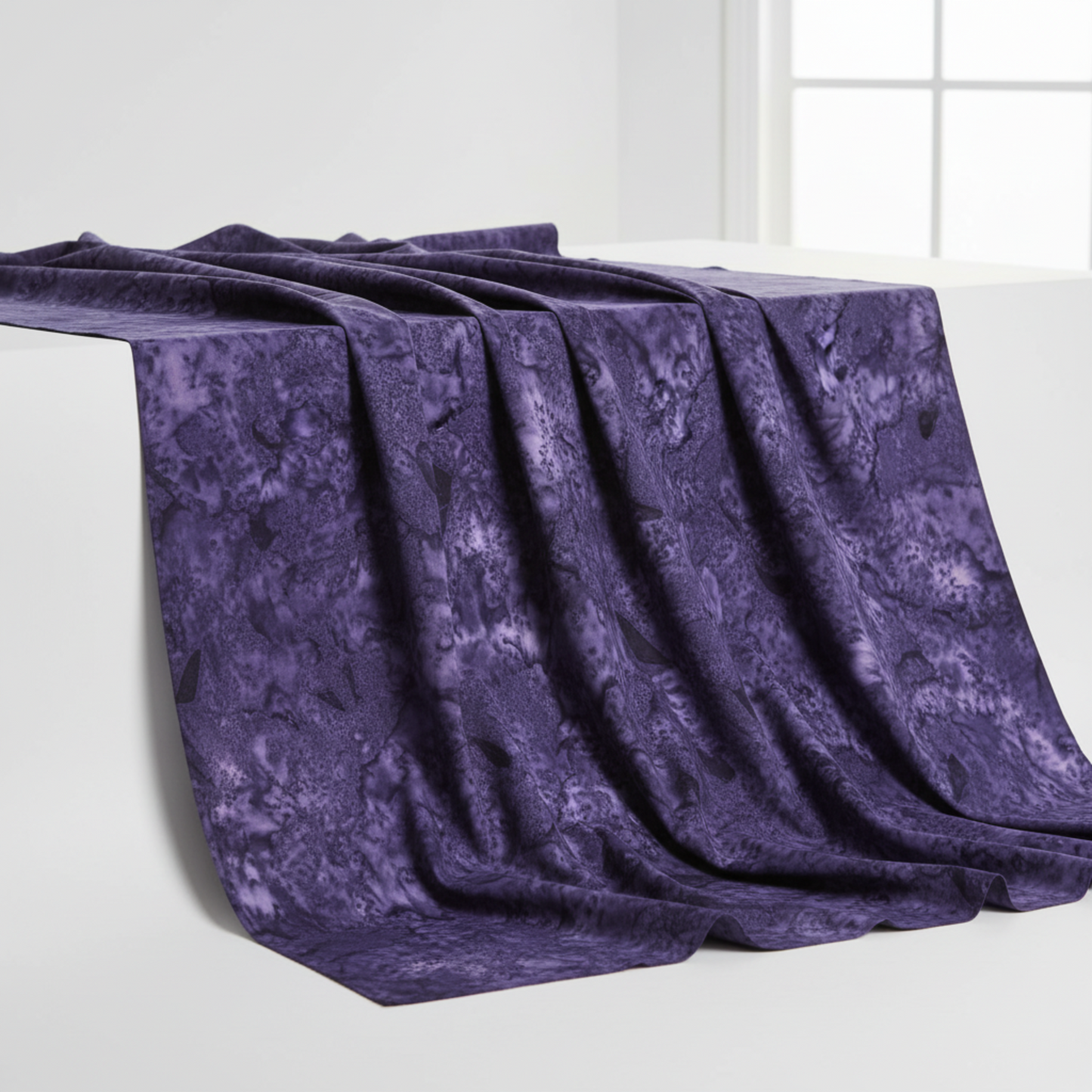 Expressions Batiks Hand-Dyes Dark Purple fabric draped to show organic tonal variation and hand-dyed batik texture – by Riley Blake Designs
