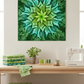 Dream Big Leaf Mint Quilt Panel by Jeanie Sumrall-Ajero for Hoffman Fabrics — hung as a wall quilt above a quilting workspace — mint, teal, and deep green leaf mandala — Janome sewing machine, stacked green fabrics, succulent, thread spools, and wicker basket below — available at IraRobi Quilts