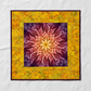 Medallion quilt featuring the Dream Big Leaf Mulberry panel by Jeanie Sumrall-Ajero for Hoffman Fabrics as the center – leaf mandala radiating from a glowing golden yellow center through warm peach-orange to rich pink and deep purple-plum outer leaves, surrounded by a scrappy pieced border of Expressions Batiks Hand-Dyes Yellow Orange Multi III by Riley Blake Designs in golden yellow, warm orange, chartreuse green, olive, and amber, finished with a deep plum binding. Quilt blocks shown for inspiration. Coor