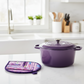 Leaf-Shaped Quilted Hot Pad – Lavender Garden beside a purple Dutch oven | Handmade kitchen gift from IraRobi Quilts