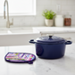 Leaf-Shaped Quilted Hot Pad – Indigo Berry beside a navy Dutch oven on marble countertop | Handmade kitchen gift from IraRobi Quilts