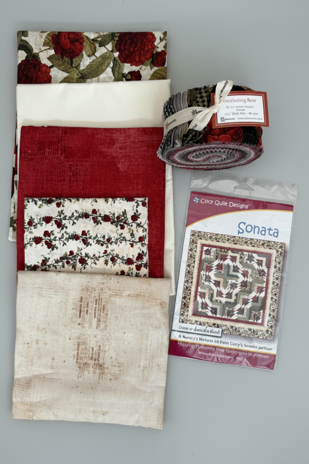 Everlasting Rose Quilt Top Kit – five coordinating cotton fabrics, Everlasting Rose jelly roll strip roll by Iron Orchid Designs for Clothworks, and Sonata quilt pattern by Cozy Quilt Designs. Makes a stunning 72"×72" throw quilt! #QuiltKit #IronOrchidDesigns #Clothworks #CrimsonQuilt #QuiltingFabric
