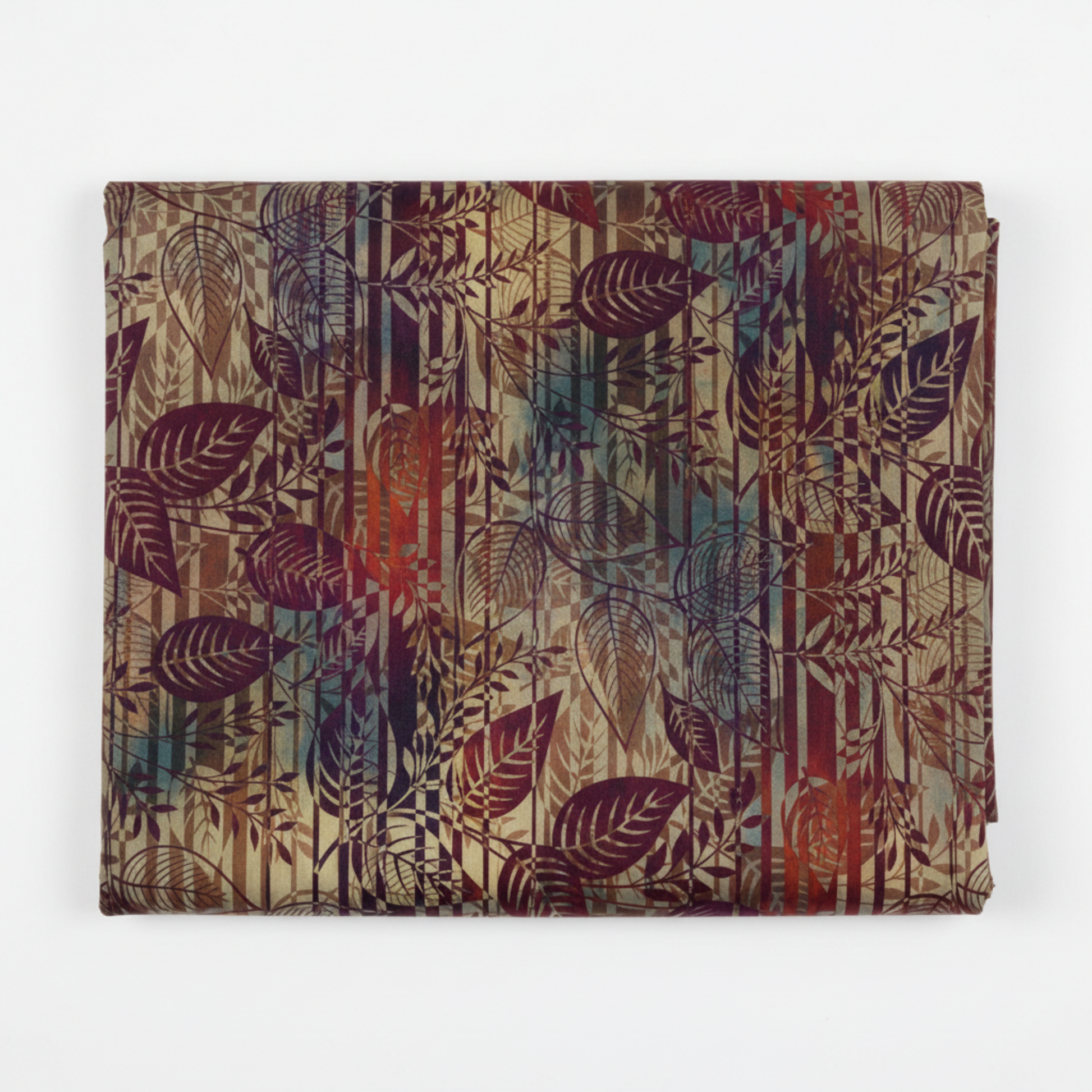 Falling Leaves Multi Leaf Stripe quilting cotton fabric folded to show large-scale botanical leaf silhouettes over vertical stripe geometric background – jewel tones of burgundy, plum, purple, teal, and burnt orange by Jason Yenter for In The Beginning Fabrics, 100% cotton, 3 yard cut