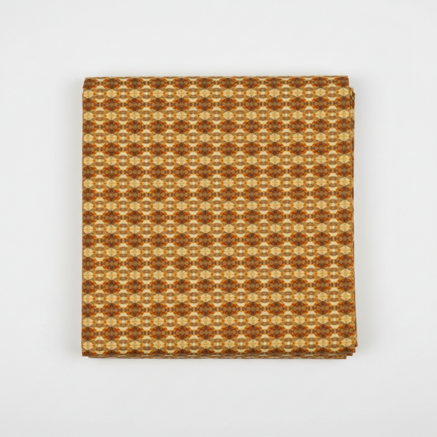 Falling Leaves Multi Prism quilting cotton fabric folded to show allover geometric kaleidoscope prism pattern – warm golden amber and rich caramel tones by Jason Yenter for In The Beginning Fabrics, 100% cotton, 3 yard cut