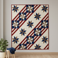Quilt shown for inspiration features the Fifty Nifty Quilt Pattern by Shadow Valley Quilts made with Thatched Navy fabric by Robin Pickens for Moda Fabrics — patriotic navy eight-pointed star blocks with bold red diagonal stripe sashing on a cream background, displayed in a modern quilting studio. Coordinating fabrics and quilt patterns available at IraRobi Quilts.