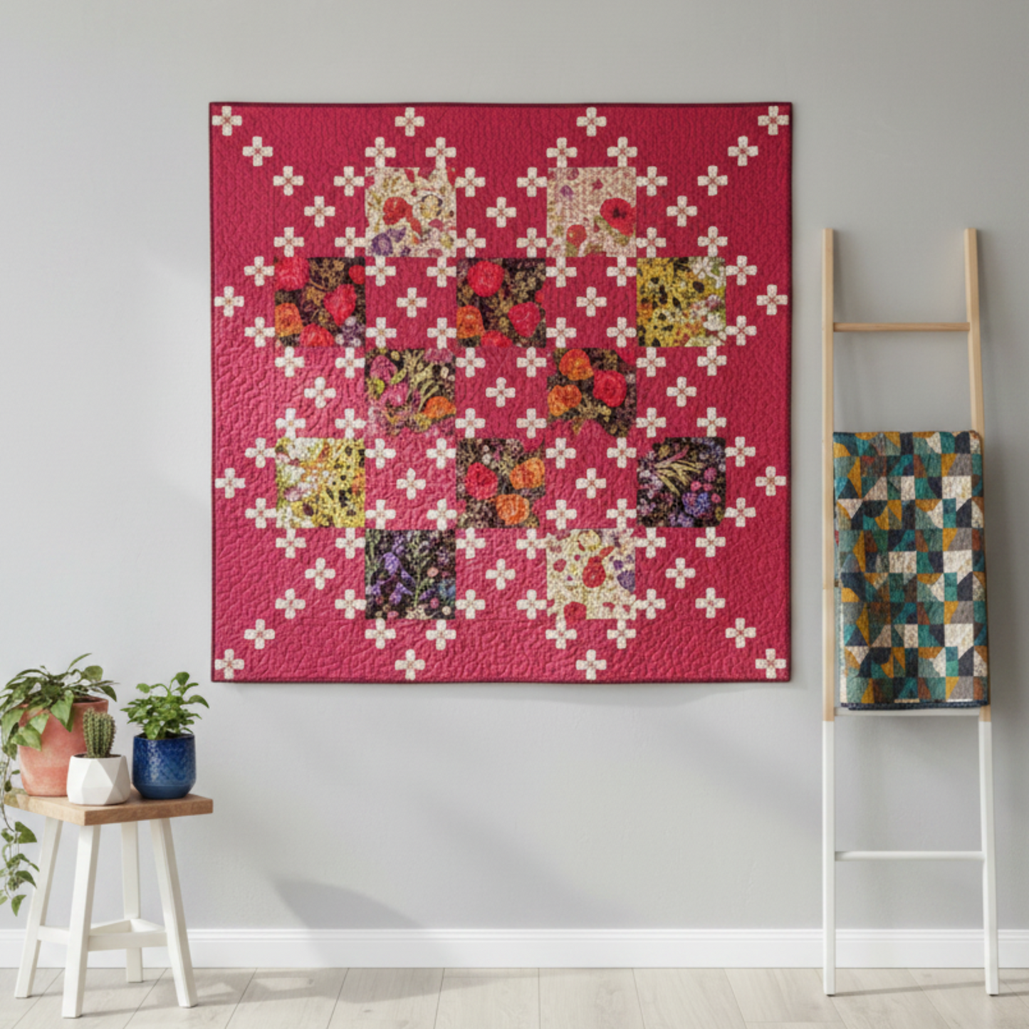 Fiona's Daisy Chain quilt pattern by Robin Pickens made with Thatched Fuchsia fabric by Robin Pickens for Moda Fabrics — bright fuchsia-hot pink tonal crosshatch background with cream nine-patch cross blocks and dark botanical floral print squares, displayed on a grey wall with a wooden ladder and stool. Quilt pattern and coordinating fabrics available at IraRobi Quilts.