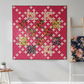 Fiona's Daisy Chain quilt pattern by Robin Pickens made with Thatched Fuchsia fabric by Robin Pickens for Moda Fabrics — vibrant fuchsia-hot pink tonal crosshatch blender with white daisy chain cross blocks. Quilt pattern and coordinating fabrics available at IraRobi Quilts.