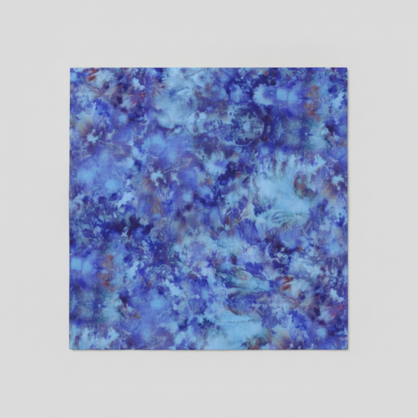 Fire & Ice by Maywood Studio Navy Ice Dye cotton quilting fabric folded flat showing full ice dye print in blue and purple tones on light grey background