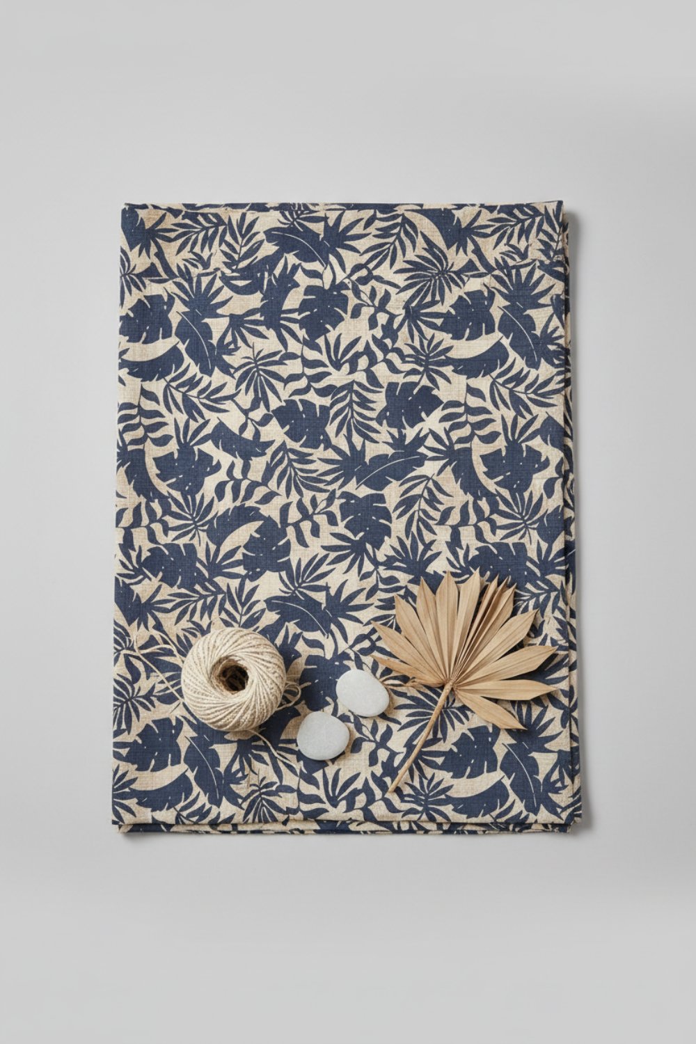 Breezeway Textured Palms Blue/Cream by Maywood Studio — cream quilting cotton with navy-blue palm and monstera silhouettes styled with coastal props — shop at IraRobi Quilts