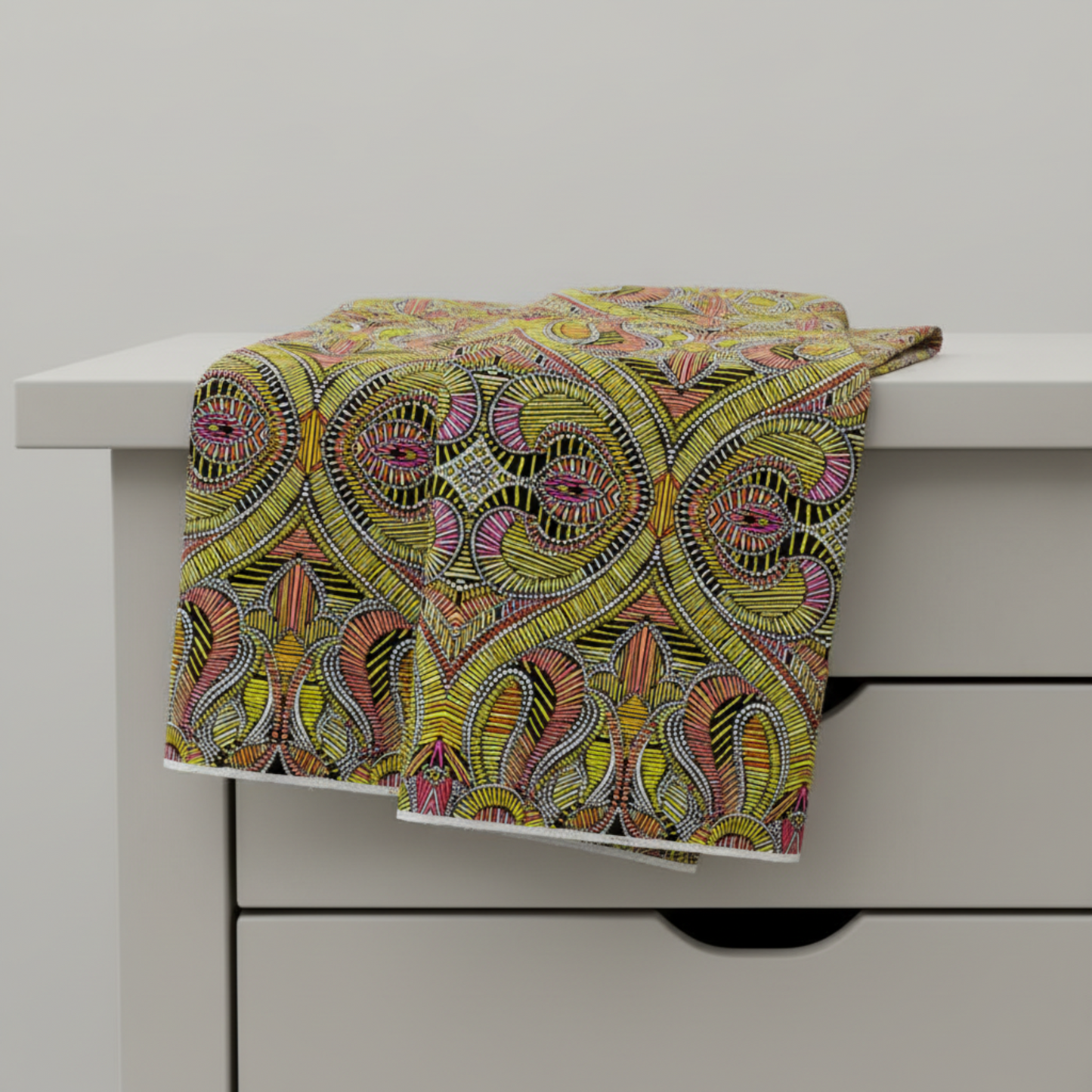 What If Good Vibes Gold/Multi fabric draped over table edge showing natural drape and body — bold citron and magenta geometric quilting cotton by Paula Nadelstern for Benartex