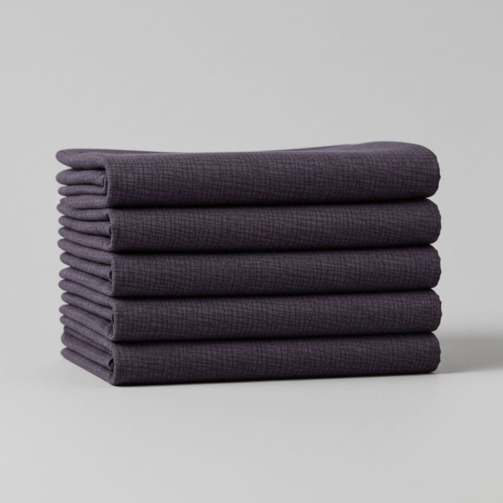Thatched Shadow deep purple fabric by Robin Pickens for Moda Fabrics – neatly folded to show fabric texture and color depth. Coordinating fabrics and quilt patterns are available at IraRobi Quilts.