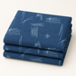 Neatly folded Bluish Stitched Up Blueprint fabric by Zen Chic for Moda Fabrics on a light studio background.