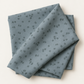 Folded Steel Crosshatch Bolt B fabric by Zen Chic for Moda Fabrics, showing the steel blue-gray print with scattered dark crosshatch marks against a light background.
