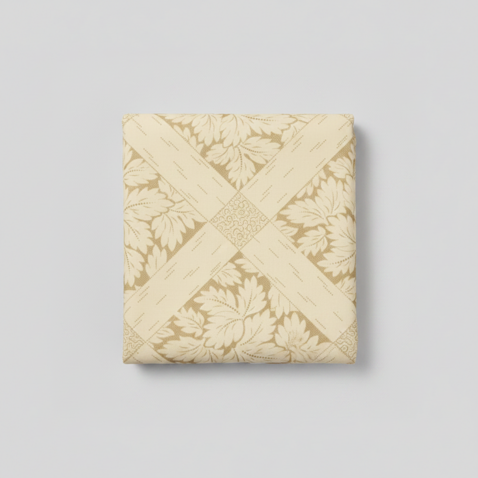 Vintage Charm Tan 108" Wide Quilt Back by Judie Rothermel for Marcus Fabrics – neatly folded yard showing tone-on-tone cream and gold lattice and leaf print on light grey background