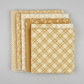Golden Era quilting cotton collection by Paula Barnes for Marcus Fabrics — coordination stack of five tan-gold and cream tonal blender fabrics fanned on light grey background, including diagonal lattice, small florals, near-solid, and vine prints