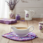 Handmade Purple Garden quilted leaf hot pad under a white ceramic gravy boat | IraRobi Quilts #handmadekitchen #hotpad #quilted