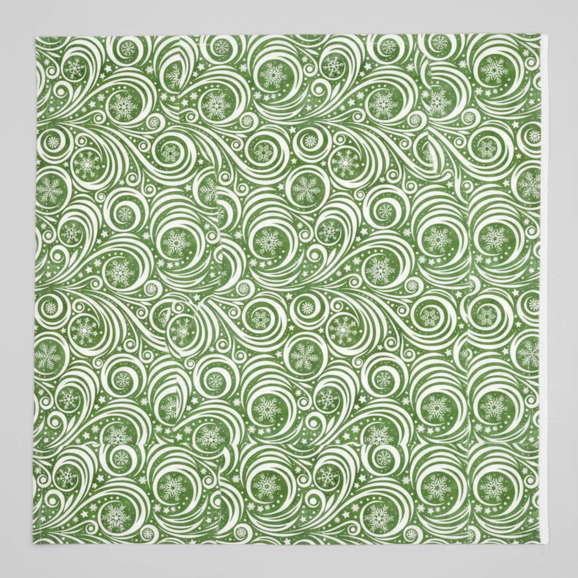 Winter Solstice II Green on White Snow Swirl quilting cotton by Jason Yenter for In The Beginning Fabrics — close-up flat lay showing flowing white scroll swirls and spirals with snowflakes nestled in the curls and tiny scattered stars on mottled watercolor green ground, 100% cotton, 43–44" wide. Quilt blocks shown for inspiration. Coordinating fabrics and quilt patterns are available at IraRobi Quilts.