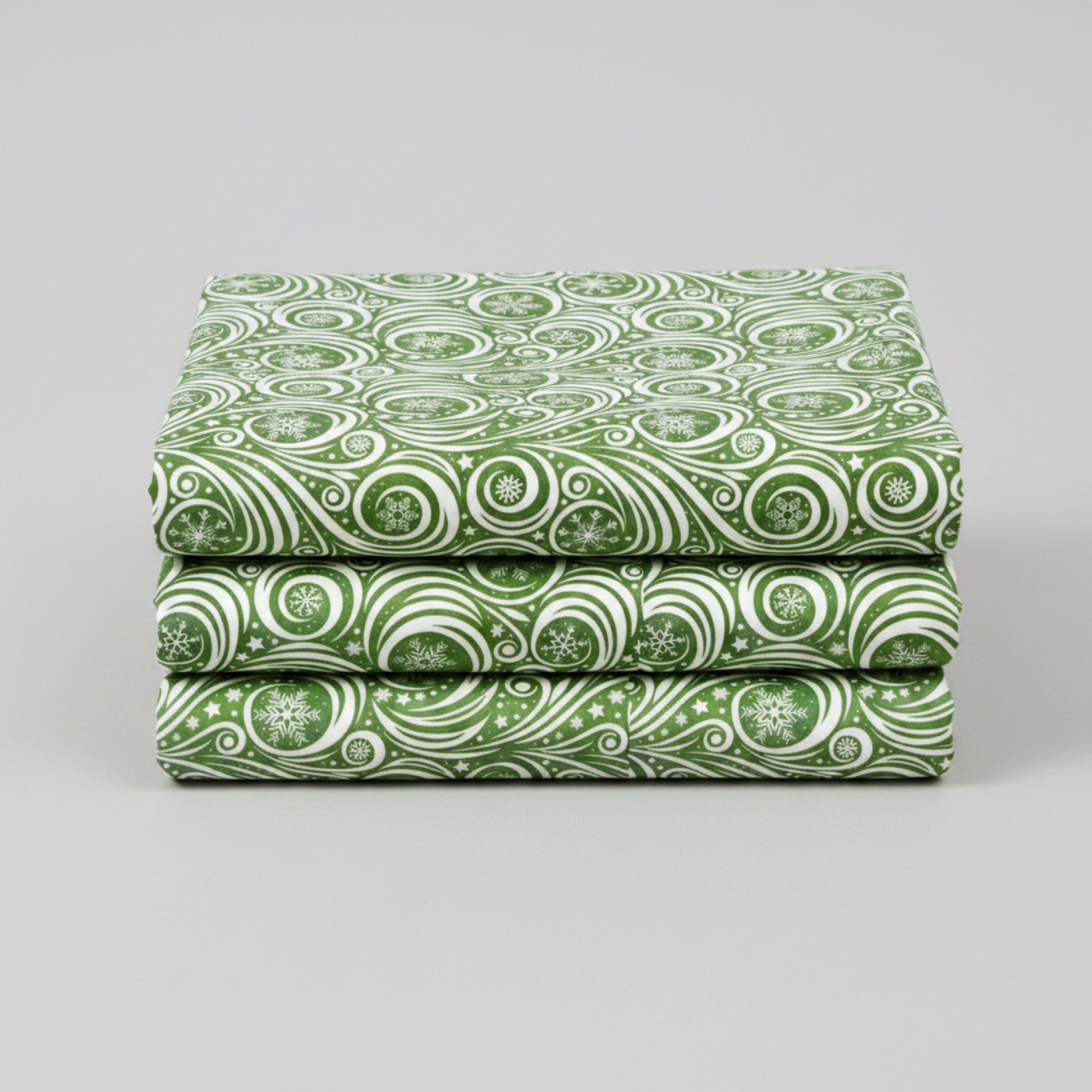 Winter Solstice II Green on White Snow Swirl quilting cotton by Jason Yenter for In The Beginning Fabrics — three folded yards stacked on a grey surface showing flowing white scroll swirls with snowflakes and scattered stars on mottled watercolor green. Quilt blocks shown for inspiration. Coordinating fabrics and quilt patterns are available at IraRobi Quilts.