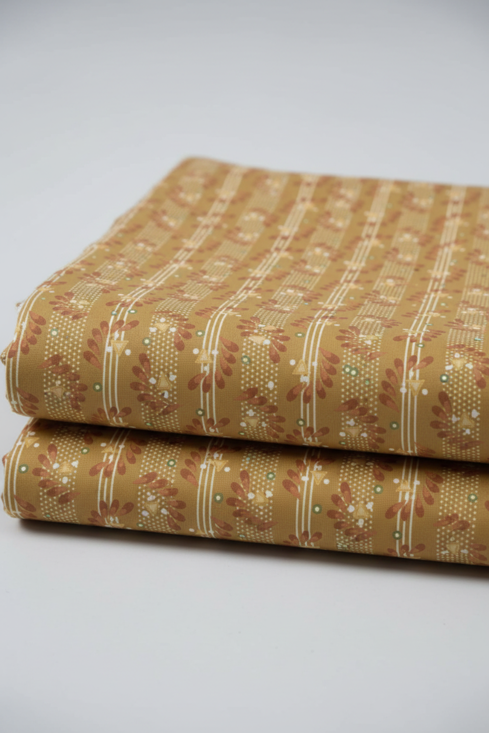 Front Porch Railings Gold by Dolores Smith for Marcus Fabrics — olive-gold quilting cotton with vertical leaf garland stripes and cream pin stripes, 100% cotton 43–44" wide