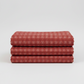 Golden Era Plaid Dot Red by Paula Barnes for Marcus Fabrics — deep crimson-red quilting cotton with tonal plaid grid and rose-pink honeycomb dot clusters, 100% cotton 43–44" wide — shop at IraRobi Quilts