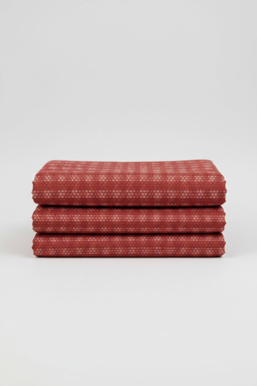 Golden Era Plaid Dot Red by Paula Barnes for Marcus Fabrics — deep crimson-red quilting cotton with tonal plaid grid and rose-pink honeycomb dot clusters, 100% cotton 43–44" wide — shop at IraRobi Quilts