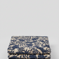 Breezeway Textured Palms Blue/Cream by Maywood Studio — cream quilting cotton with bold navy-blue silhouette tropical palm and monstera leaf motifs, 100% cotton 43–44" wide — shop at IraRobi Quilts