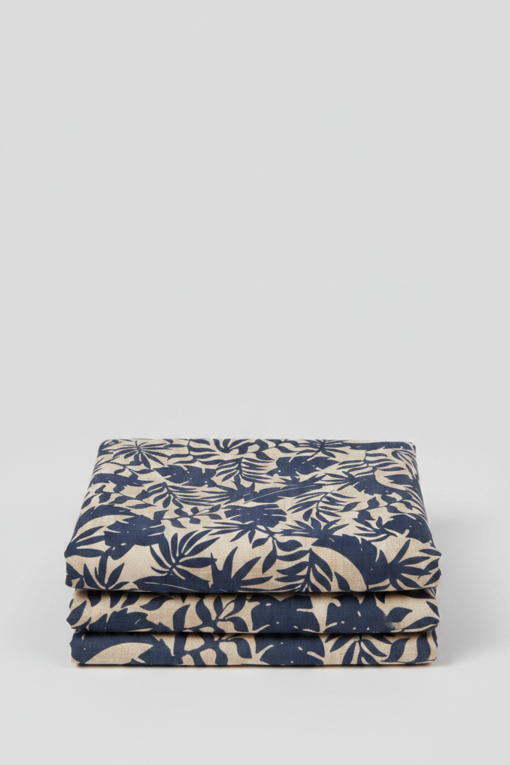 Breezeway Textured Palms Blue/Cream by Maywood Studio — cream quilting cotton with bold navy-blue silhouette tropical palm and monstera leaf motifs, 100% cotton 43–44" wide — shop at IraRobi Quilts