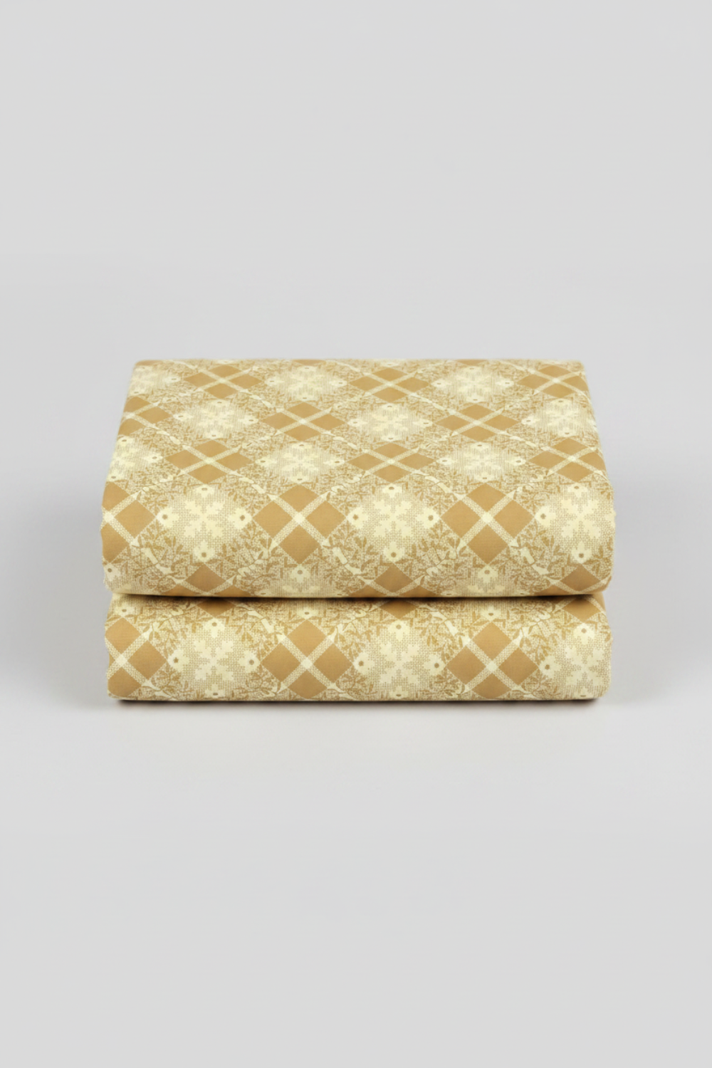 Golden Era Floral Plaid Tan by Paula Barnes for Marcus Fabrics — warm tan-gold quilting cotton with diagonal lattice grid and cream floral wreath motifs, 100% cotton 43–44" wide — shop at IraRobi Quilts