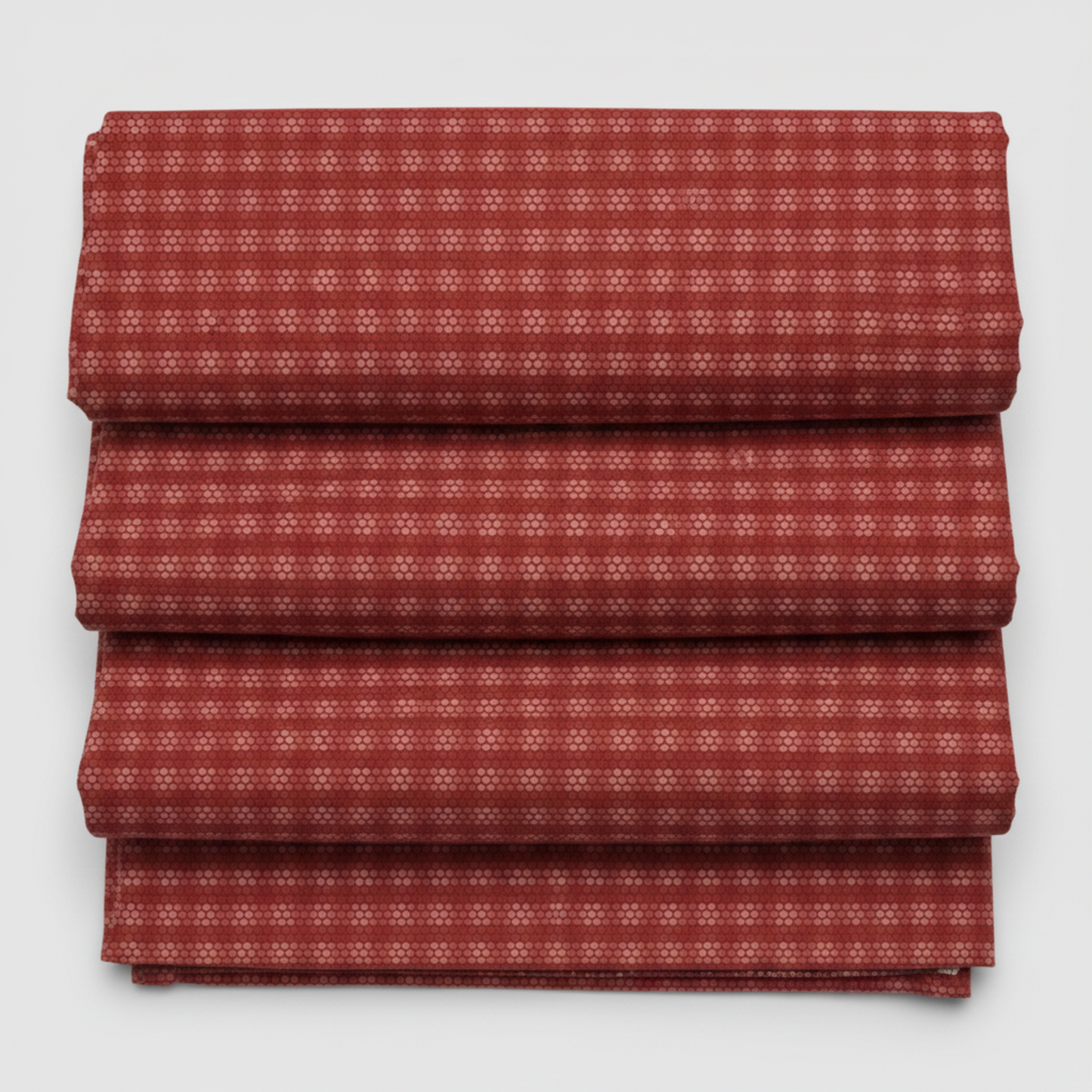 Golden Era by Paula Barnes, Plaid Dot Red quilting cotton for Marcus Fabrics — neatly folded fabric showing deep crimson-red ground with tonal plaid grid texture and rows of rose-pink honeycomb dot clusters, 100% cotton 43–44" wide