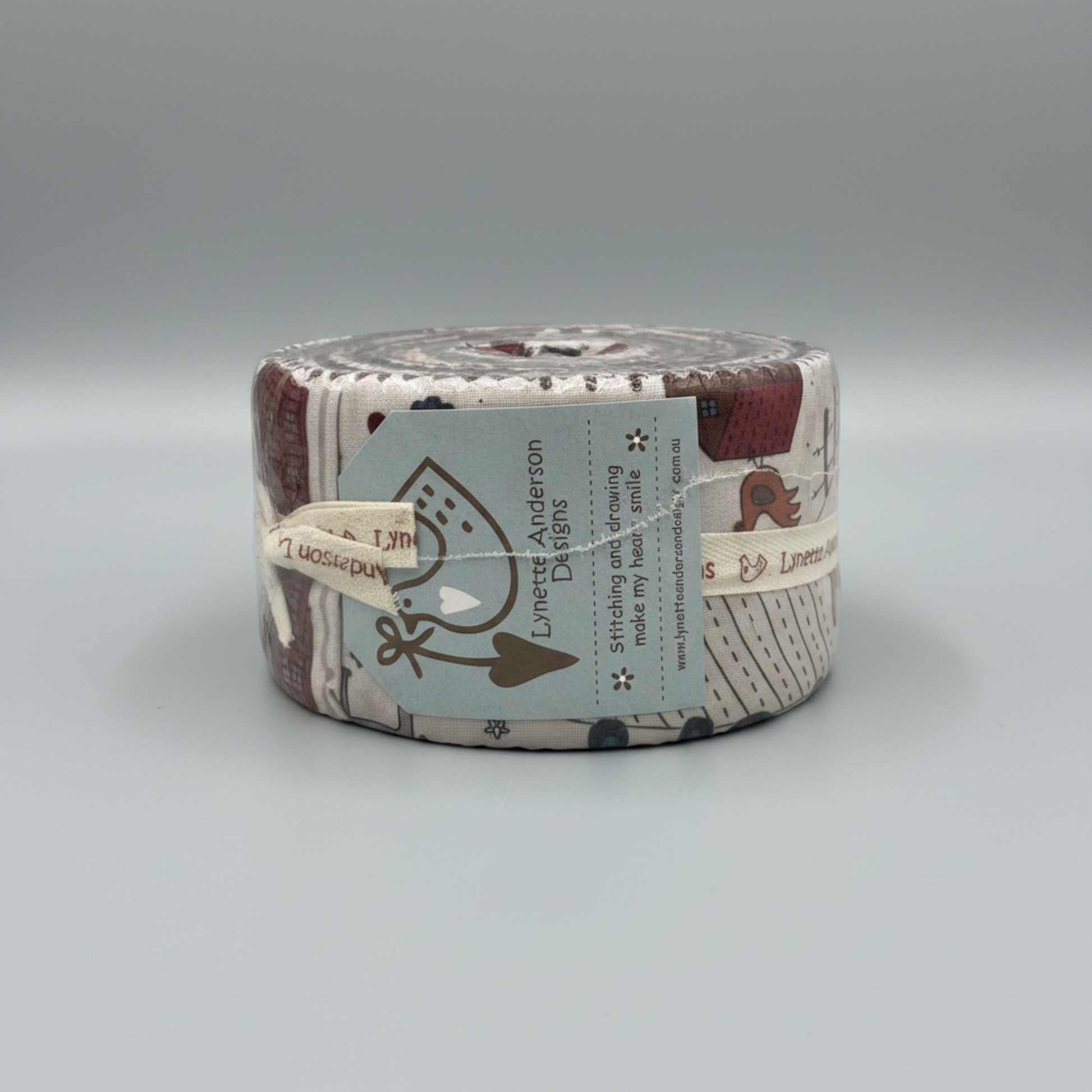 High Meadow Farm Jelly Roll by Lynette Anderson Designs – front view showing Lynette Anderson Designs label and farm print fabrics with chickens and folk-art motifs