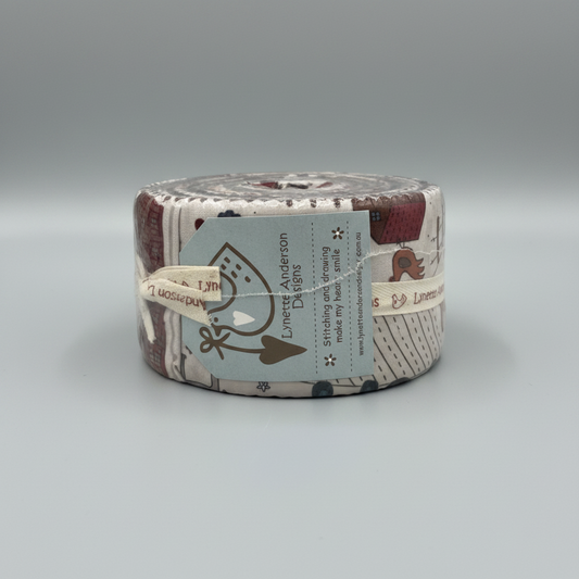 High Meadow Farm Jelly Roll by Lynette Anderson Designs – front view showing Lynette Anderson Designs label and farm print fabrics with chickens and folk-art motifs
