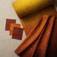 I Dream In Color Gold Ombre fabric by Jason Yenter for In The Beginning Fabrics folded on a warm linen surface with coordinating amber, pumpkin, and burgundy fabrics – allover ombre bubble dot pattern from golden yellow to deep burgundy-brown, perfect for bold warm-toned quilt projects, 100% cotton, 3 yard cut