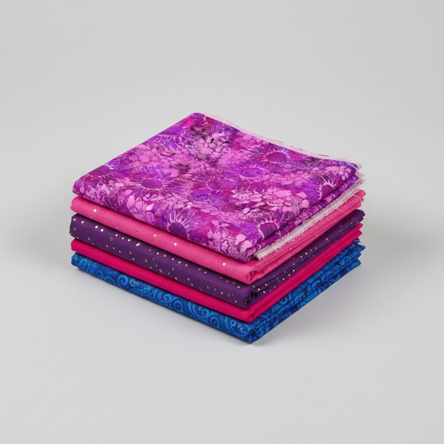 I Dream In Color Sunflower Magenta quilting cotton fabric by Jason Yenter for In The Beginning Fabrics shown in a coordinate stack with complementary jewel-toned fabrics in deep purple, hot pink, cobalt blue, and fuchsia – dense allover tonal shadow floral with silhouetted sunflowers and daisy clusters, 100% cotton, 3 yard cut