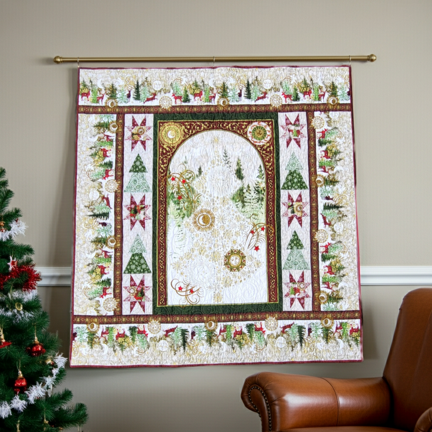 Winter Solstice II Metallic Quilt Panel 36" by Jason Yenter for In The Beginning Fabrics — shown as the centerpiece of a finished panel wall quilt hanging in a warm holiday living room with a Christmas tree and leather armchair. Quilts shown for inspiration. Coordinating fabrics and quilt patterns are available at IraRobi Quilts.