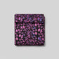 Halcyon II Magenta Vines fabric folded into 3-yard cut square showing pink, magenta, and blue botanical vine pattern on black cotton by Jason Yenter for In The Beginning Fabrics