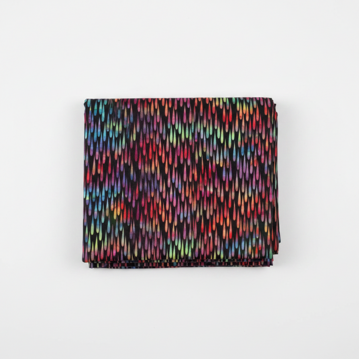 Impressions Multi Dark Raindrops quilting cotton fabric folded to show dense allover teardrop pattern – jewel-toned reds, pinks, teals, greens, and yellows on deep dark ground by Jason Yenter for In The Beginning Fabrics, 100% cotton, 3 yard cut