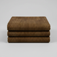 Folded Interwoven Brown quilting cotton fabric on a light grey background – by Jason Yenter for In The Beginning Fabrics. Shop at IraRobi Quilts | #brownfabric #interwoven #quiltingfabric #neutralfabric #blenderfabric