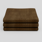 nterwoven Brown Fabric by Jason Yenter for In The Beginning Fabrics folded to show the rich deep brown geometric crosshatch print and texture