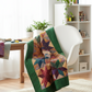 Interwoven Dark Green Fabric by Jason Yenter for In The Beginning Fabrics as sashing and border in a modern traditional quilt draped over a sewing chair — paired with coordinating jewel tones in red, gold, plum, and teal. Quilt blocks shown for inspiration. Coordinating fabrics and quilt patterns are available at IraRobi Quilts.