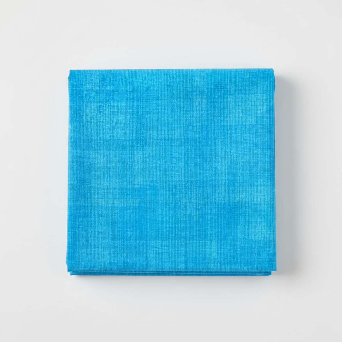 Interwoven Deep Sky Fabric by Jason Yenter for In The Beginning Fabrics — neatly folded fat quarter showing vivid bright sky blue crosshatch texture with subtle electric cyan to cerulean tonal shifts. Clean white surface, soft natural light. 100% cotton, 43–44" wide.