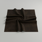 Interwoven Espresso Fabric by Jason Yenter for In The Beginning Fabrics folded to show the near-black espresso brown geometric crosshatch print and texture