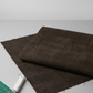 Near-black espresso brown quilting cotton fabric in a bright modern sewing room with cutting mat and rotary cutter – Interwoven Espresso by Jason Yenter. Shop at IraRobi Quilts | #espressofabric #interwoven #quiltingstudio #sewingroom #quiltingfabric