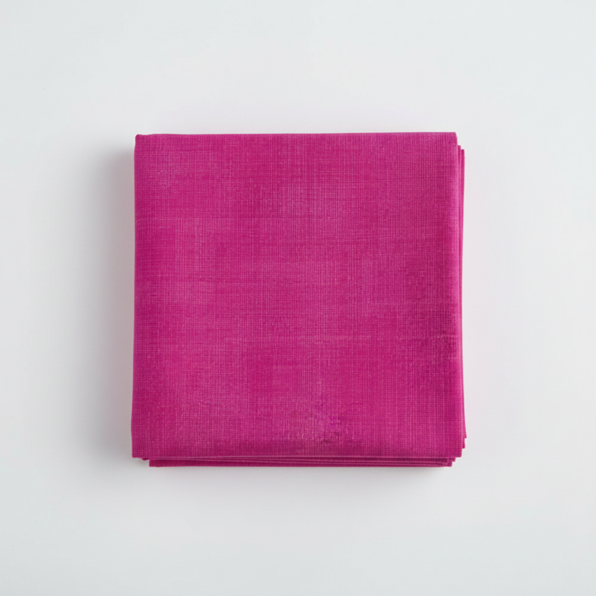 Interwoven Hot Pink Fabric by Jason Yenter for In The Beginning Fabrics — neatly folded fat quarter stack showing vivid hot pink crosshatch texture print with subtle tonal shifts from bright magenta-pink to deep fuchsia. Clean white surface, soft natural light. 100% cotton, 43–44" wide.